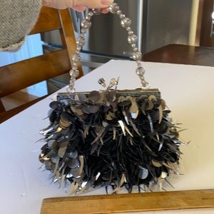 Ladies black spangled evening bag.